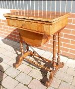 Victorian Walnut games and sewing table: Top has slight warp.