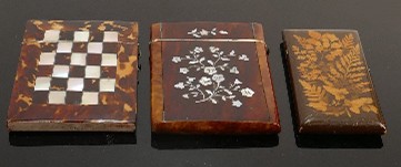 Three antique card cases tortoiseshell & Mauchline fern ware: Two very different designs of