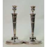 Pair of 19th century French silver candlesticks: Weight 876g, height 27.5cm.