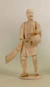 Early 20th century Japanese ivory sectional figure: Of man with basket & fish, height 24.5cm. (end