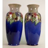 A pair of large Royal Doulton Lambeth vases: Decorated all around with fruit and flowers, height