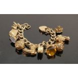 Very heavy 9ct gold charm bracelet with large charms: Gross weight 123 grams, 12 charms.