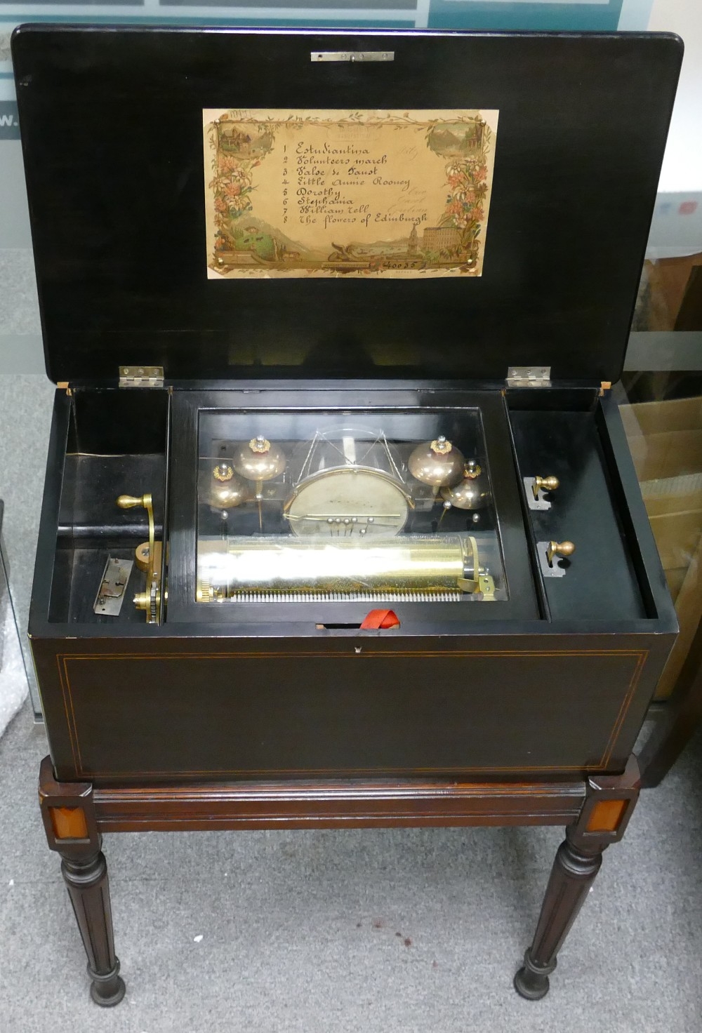 Late 19th century inlaid Swiss Musical Box on stand: Playing on 4 bells & drum with 6 hammers,