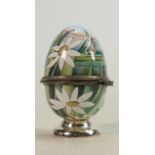 Moorcroft enamelled lidded egg decorated with rabbits: Height 6.5cm.