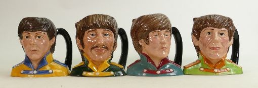 Royal Doulton set of mid size character Jugs The Beatles: Comprising John Lennon D6725, Paul