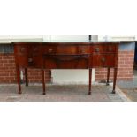 Regency Mahogany inlaid bow front sideboard on tapered legs and spade feet: Compartmentalised wine