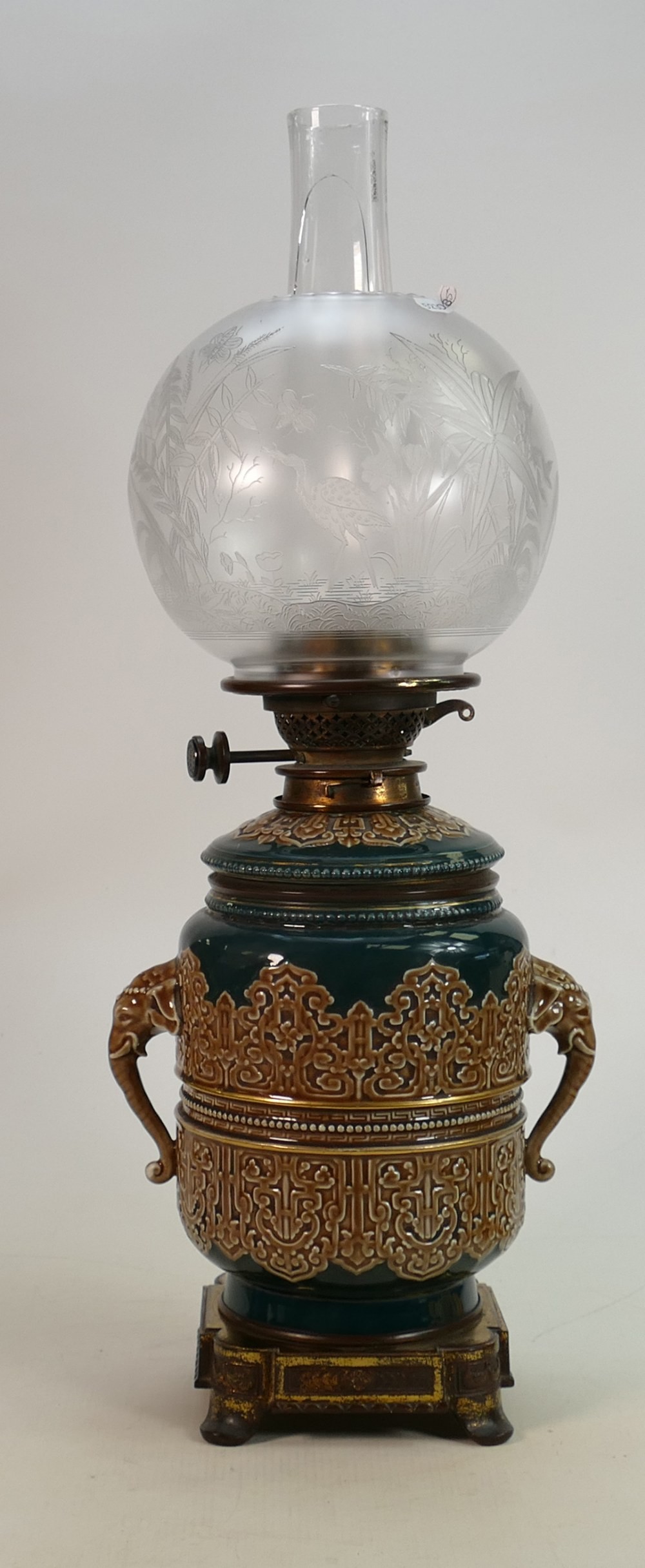 Victorian pottery oil lamp with Hinks burner: Embossed pottery lamp base with elephant head