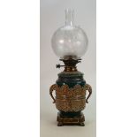 Victorian pottery oil lamp with Hinks burner: Embossed pottery lamp base with elephant head