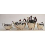 Silver four piece decorative tea set: Hallmarked for Birmingham 1958, wooden handles to teapot &