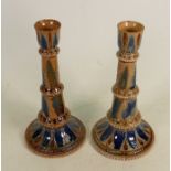 A Pair of Doulton Lambeth candlesticks: Decorated by Arthur Barlow, height 23cm. (slight chip to