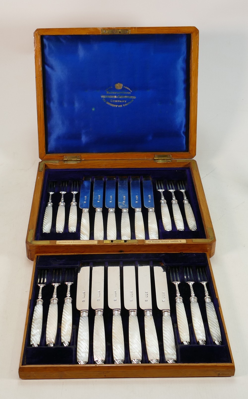 Mother of pearl handled silver hallmarked fruit knives and forks: Cased set for 12 persons in 2