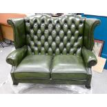 High wingback Queen Anne 2 setter Chesterfield: In green leather.