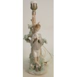 Lladro figural lamp base boy standing by tree: Height 34cm. (Something missing from boys hand).