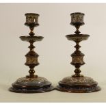 A pair of Doulton Lambeth candlesticks: Decorated by Frank Arthur Butler with brass stems, height