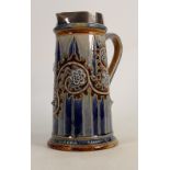 A Doulton Lambeth jug decorated with scrolling foliage: by George Tinworth height 27cm, signed and