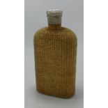 Large Wicker clad spirit bottle: With pewter screw top lid, height 22cm.