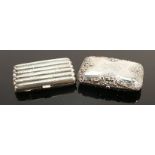 Two silver cigarette cases: Gross weight 136 grams. (2)