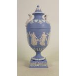 A Wedgwood two handled light blue dip Jasperware urn & cover: Decorated with dancing hours ladies,