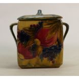 William Moorcroft pottery two-handled biscuit barrel and cover: In the Pomegranate design on ochre