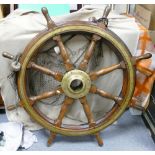A really fine large teak and brass ships wheel: Believed to have been removed from an old London