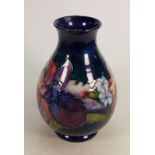 Walter Moorcroft vase decorated in the Orchid design: Height 25cm.