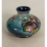 Walter Moorcroft small squat vase decorated in the Columbine design: Height 8cm.