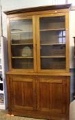 Impressive Edwardian oak bookcase: Storage base below with glazed bookcase above. 144cm wide x 240cm
