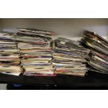 A collection of 45 rpm singles 1970's/1980's mixed genres: viewing advised.