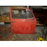 A 1960's VW Beetle drivers side door: red.