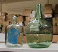 Two Large Decorative Green Glass Bottles: height of tallest 31cm