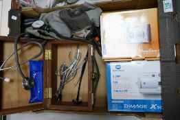 A mixed collection of items to include: medical equipment, boxed digital camera's etc