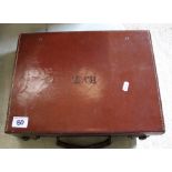 A vintage brown leather attache case: initialed HVT.