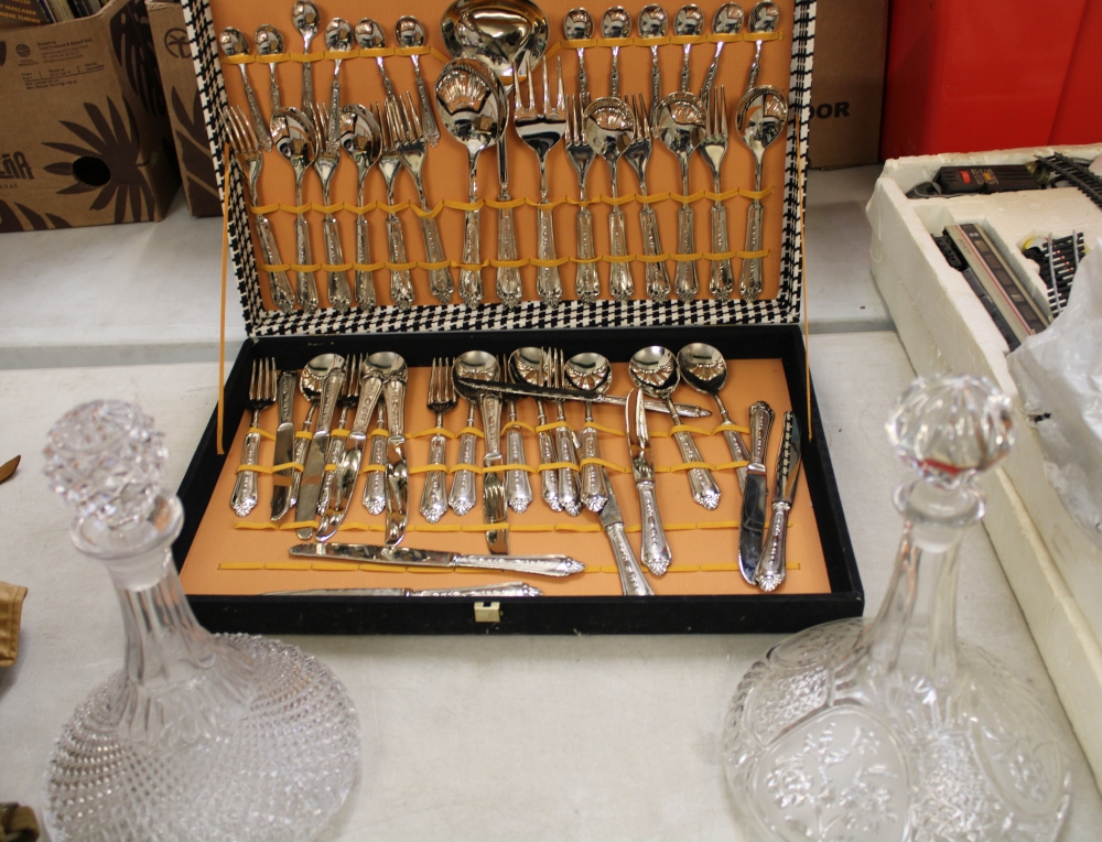 Cased Italian silver plated cutlery set: together with 2 ships decanters.