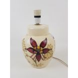 Moorcroft Columbine pattern lampbase: on a cream ground, overall height 28cm.