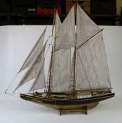 Vintage model wooden sailing boat/clipper on stand: overall height 89cm.