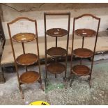 Three early 20th century folding oak cake stands (3).