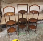 Three early 20th century folding oak cake stands (3).