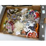 A large collection of costume jewellery: to include necklaces, brooches, bangles etc