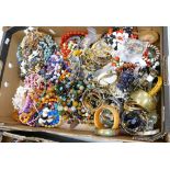 A large collection of costume jewellery: to include necklaces, brooches, bangles etc