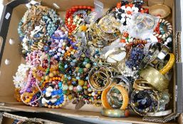 A large collection of costume jewellery: to include necklaces, brooches, bangles etc