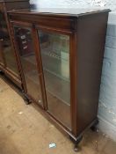 Glazed china display cabinet with glass shelves: raised on cabriole front supports, 92cm wide.