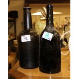 Two Large Early Hand Blown Glass Bottles: height of tallest 26cm(2)