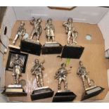 A collection of polished pewter soldier figures: