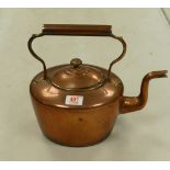 A large copper kettle: height with handle 30cm