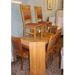 Modern, quality extending dining table and 6 chairs: honey oak finish, table extends to 190cm.