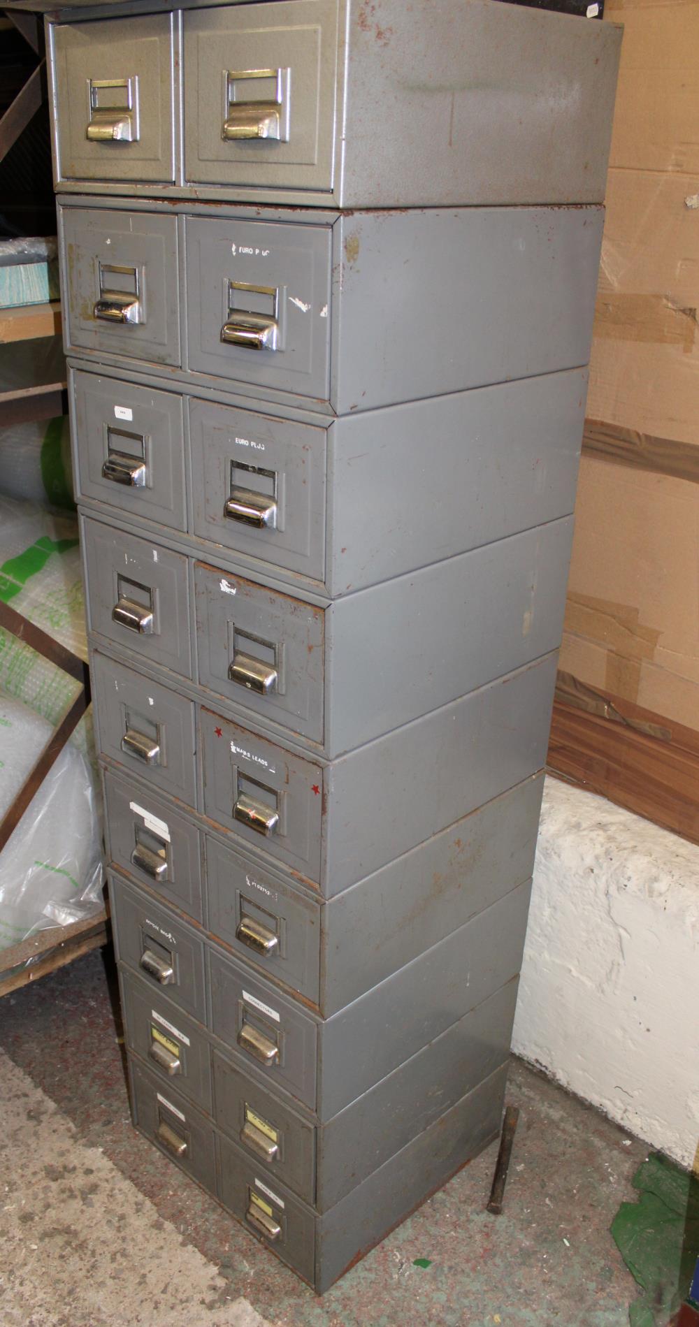 A metal filing cabinet: 131cm x 40cm x 39cm together with a single filing cabinet