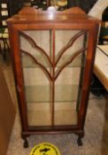 Mahogany single door display/china cabinet: glass shelves to interior, raised on ball and claw feet,