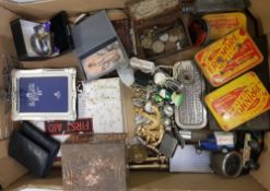 A mixed collection of items to include: advertising tins, watches, costume jewellery, silver