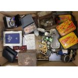 A mixed collection of items to include: advertising tins, watches, costume jewellery, silver