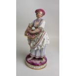 19th Century continental figure of a flower seller: 18cm in height.